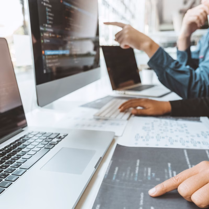 Development team coding in software company