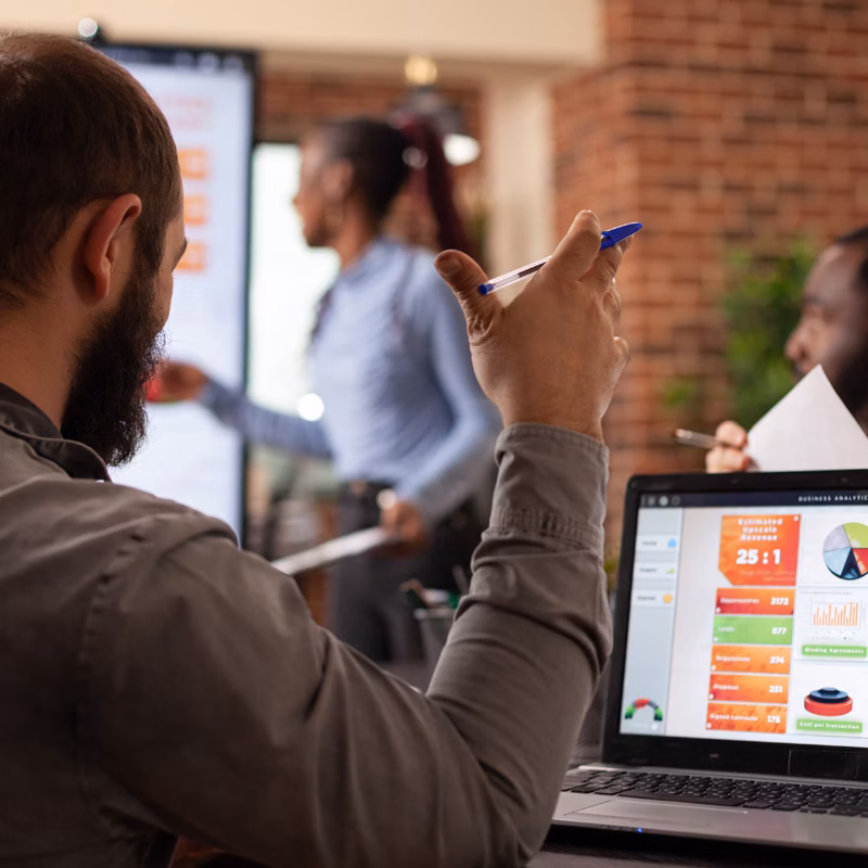 Businessman analyzing company performance graphs
