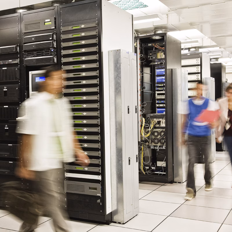 Technicians working in computer server room